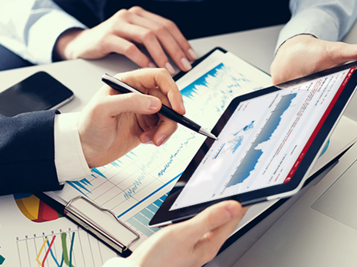 Image of two people’s hands holding a tablet, displaying Connect Analytics for Product iQ